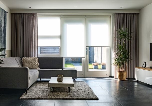 A living room with a couch and table